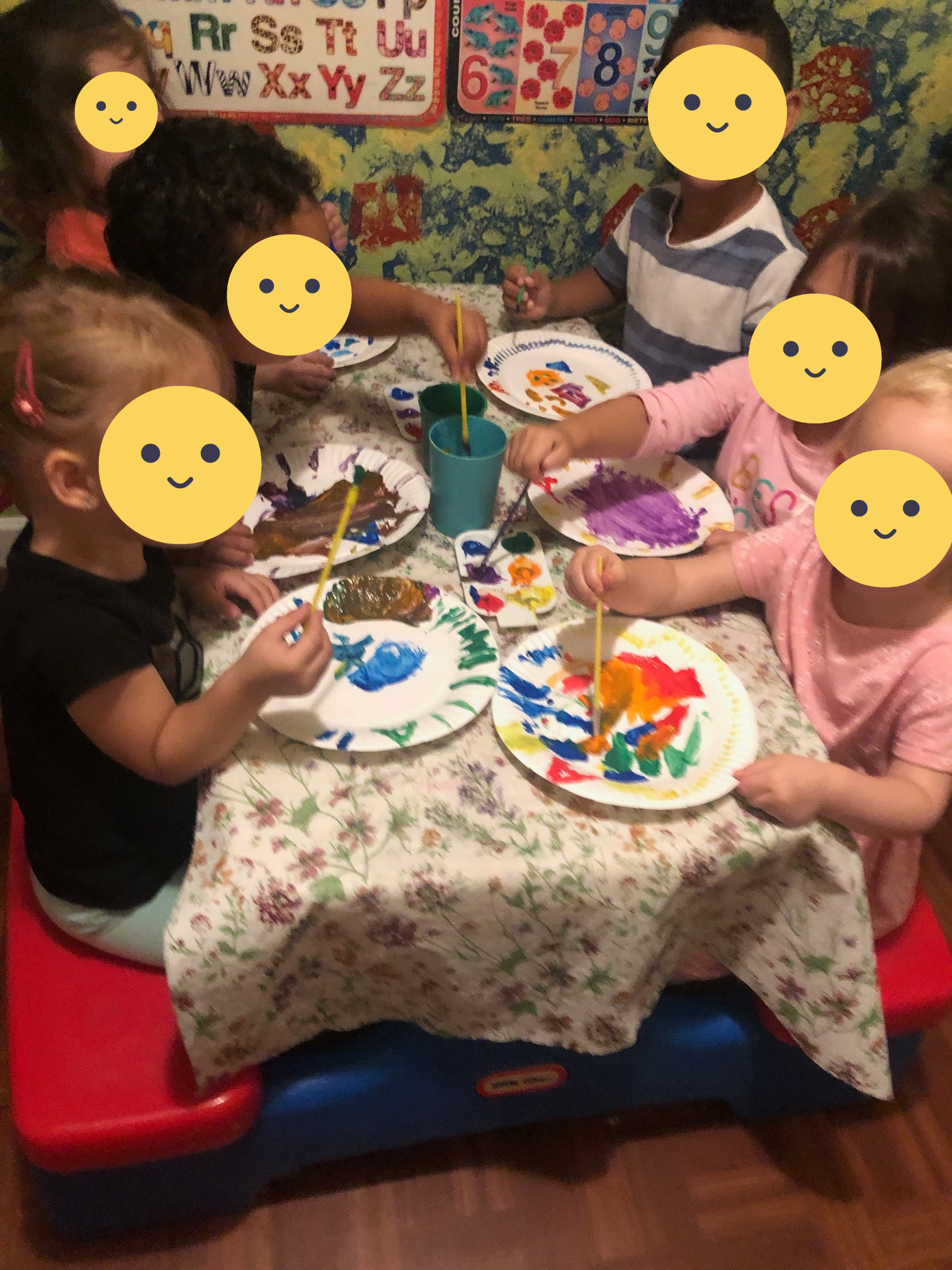 Children mixing paint during class time.